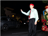 Mayor Waving to Patrons in their cars as hey drive through the parade