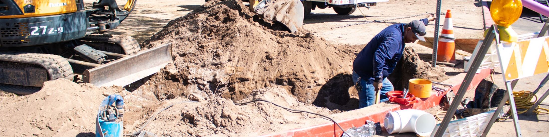 Public Works Employee Working on Water Pipes