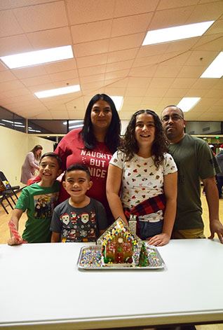 Smiling Family With House